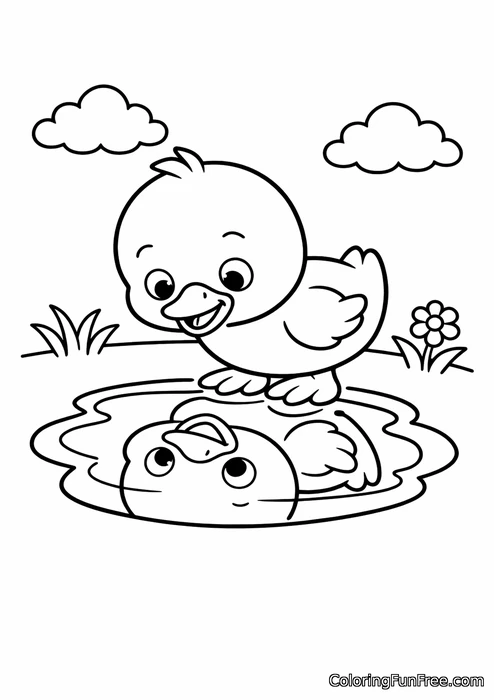 Duckling looking at its reflection in a puddle