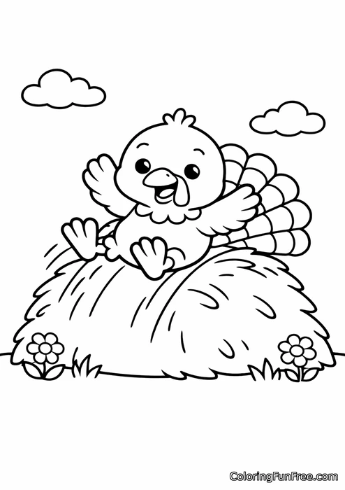 Little turkey sliding down a hill of hay